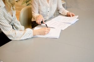 A woman meets with a probate attorney for an initial consultation. 